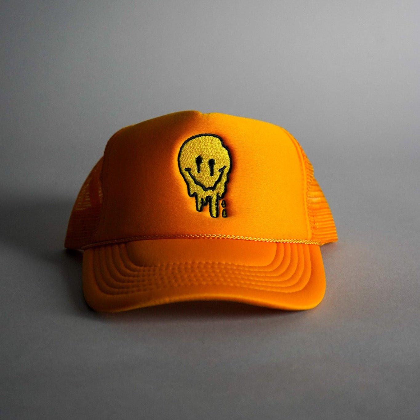 Melted Smiley Face Trucker Hat - Gold