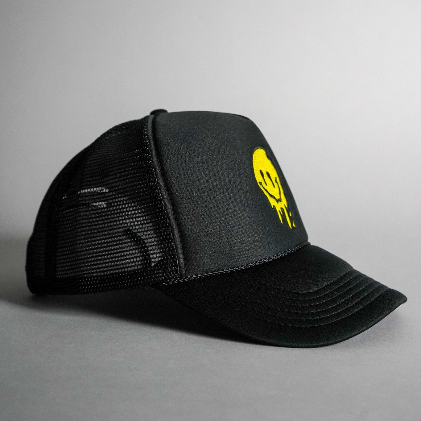 Melted Smiley Face Trucker Hat - Black