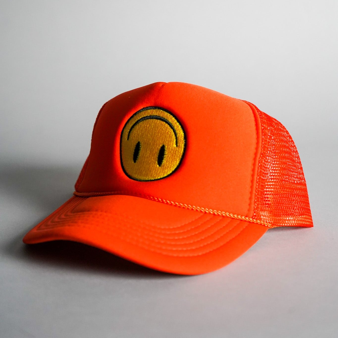 Upside Down Smiley Face Trucker Hat - Orange