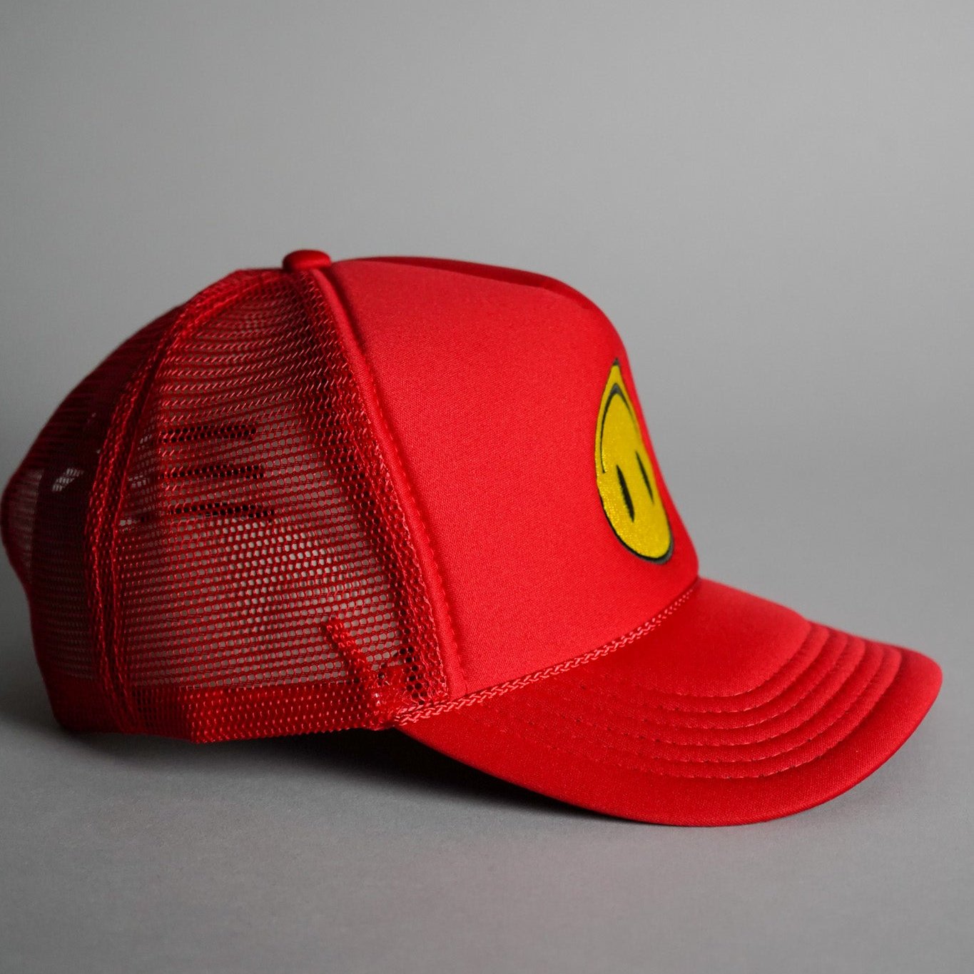 Upside Down Smiley Face Trucker Hat - Red