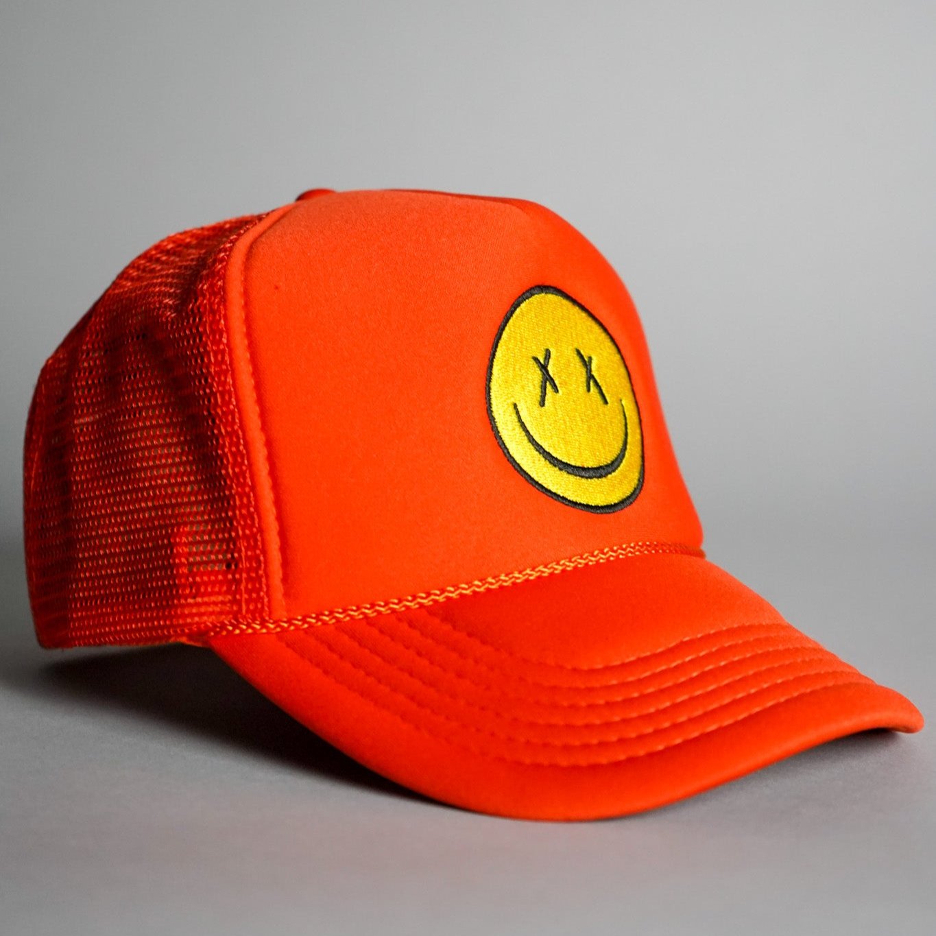 X Eyes Smiley Face Trucker Hat - Orange