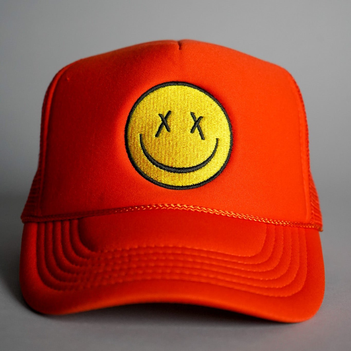 X Eyes Smiley Face Trucker Hat - Orange